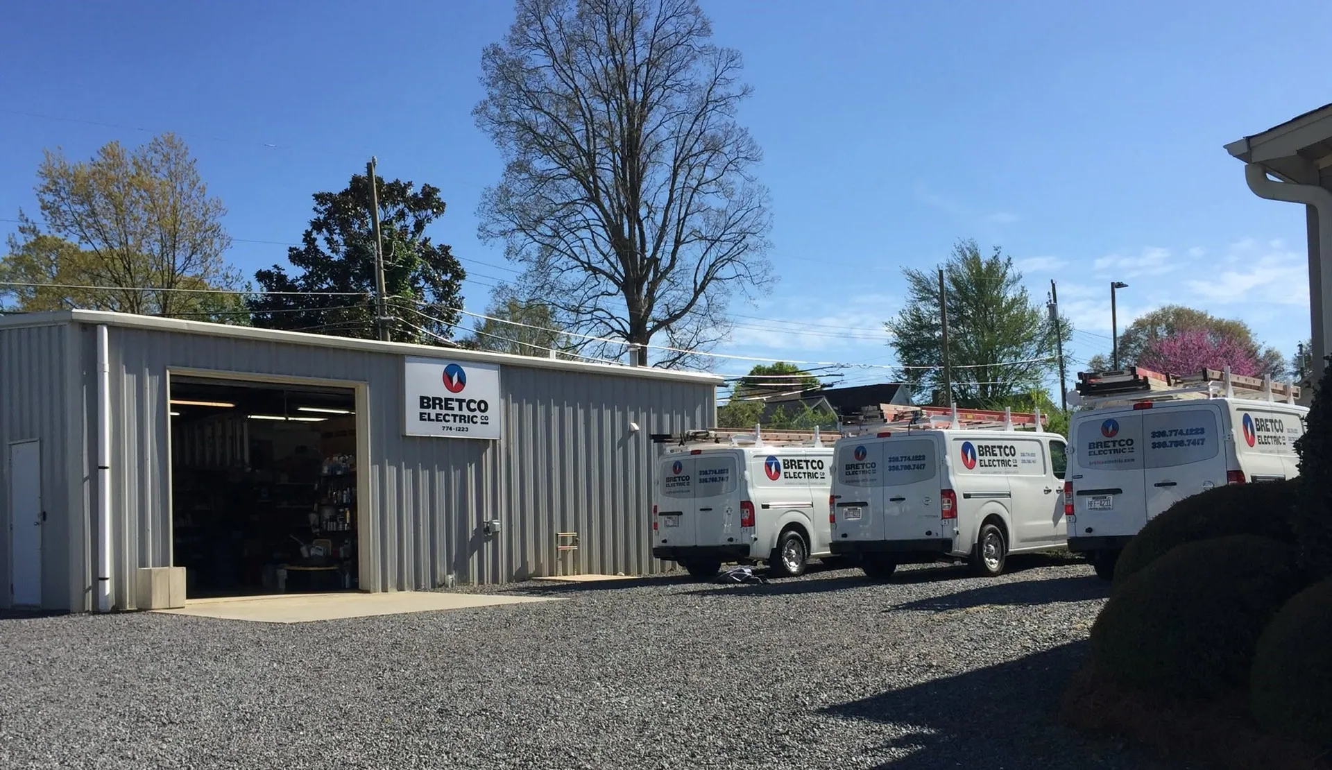 Bretco Electric fleet vans metal warehouse gravel lot