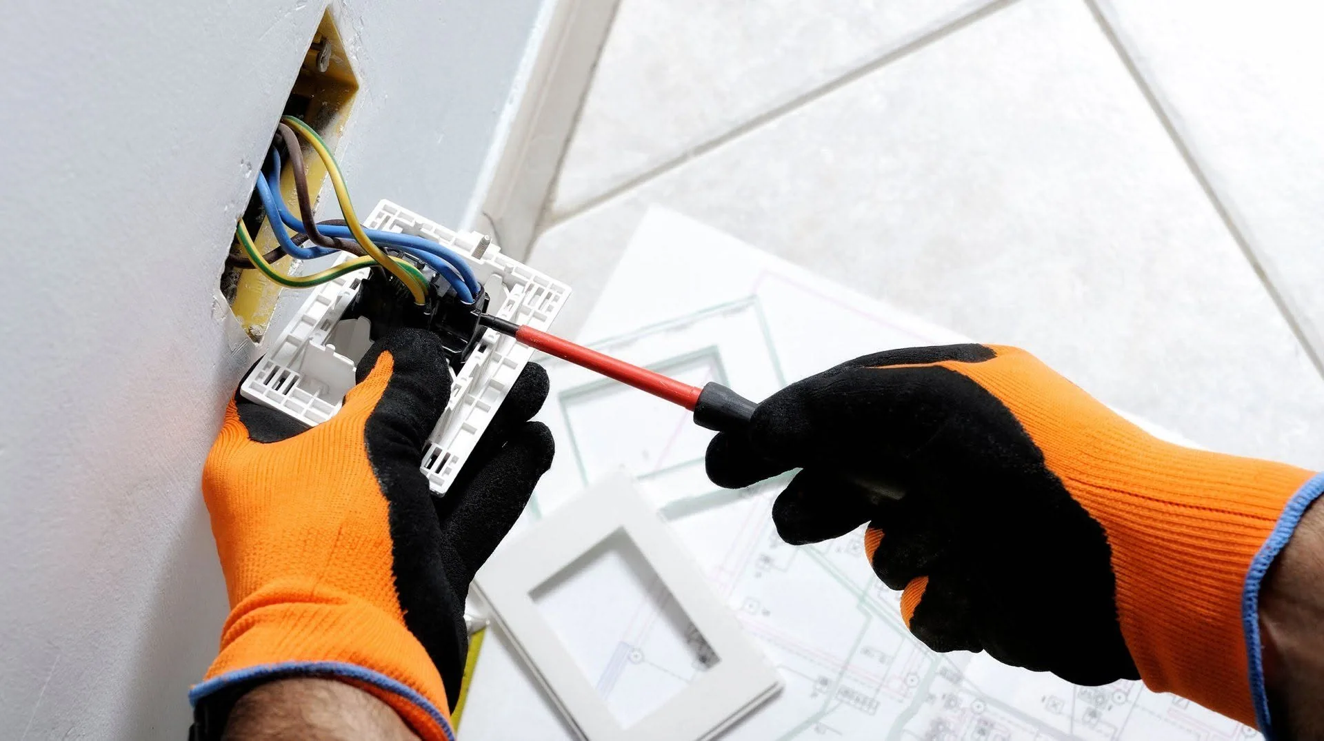 Orange gloves screwdriver wall switch wiring blueprint floor