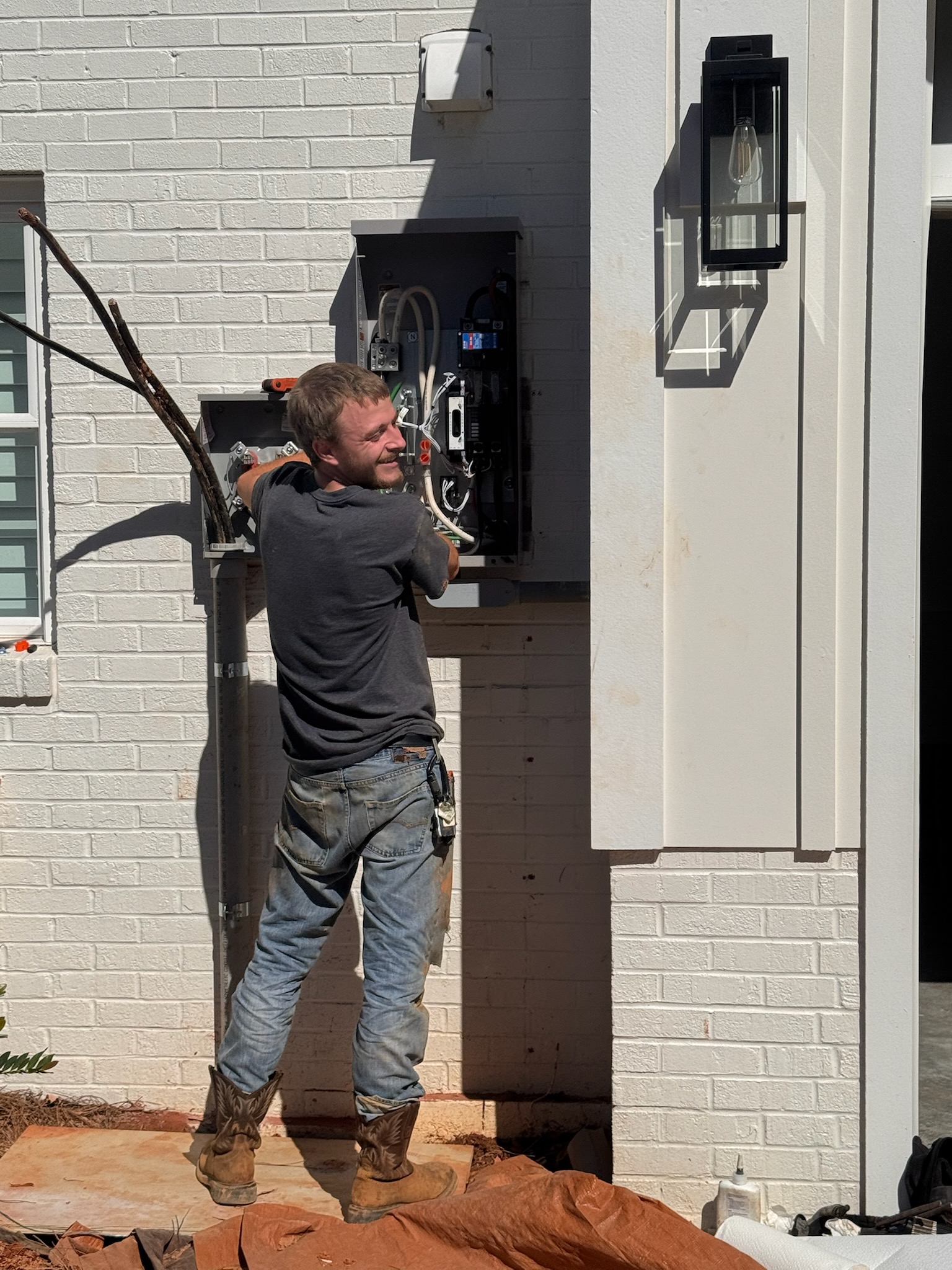 Residential electrical service working on a breaker panel by Bretco Electric
