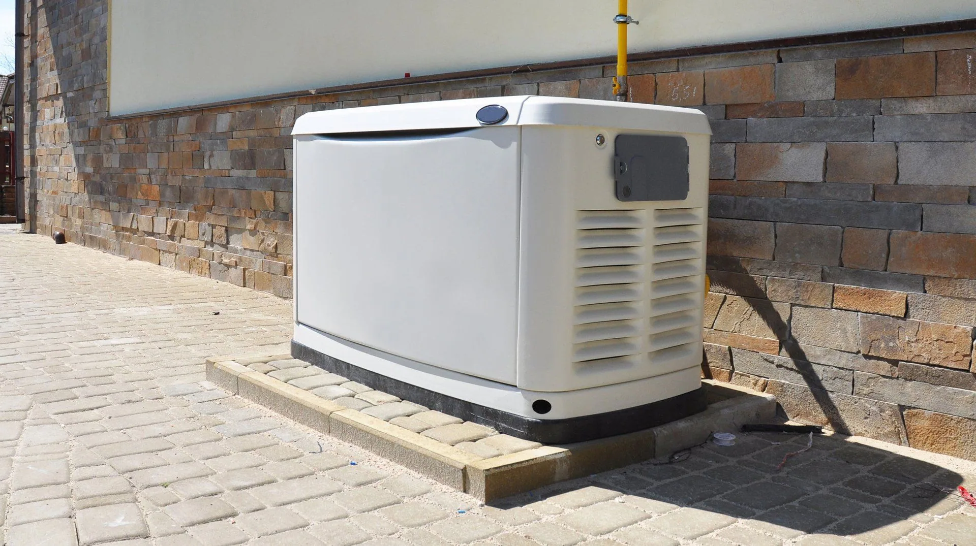 Standby generator paver pad stone wall